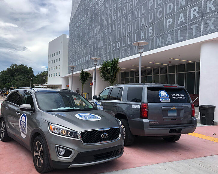 locksmith technician arriving at a Miami property with fully stocked service van