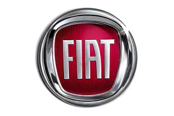 The image shows the Fiat logo, featuring bold, uppercase white letters spelling FIAT on a red background with vertical stripes. The logo is encased in a shiny silver circular border, creating a three-dimensional effect reminiscent of precision craftsmanship, much like expert locksmith services in Miami, FL.